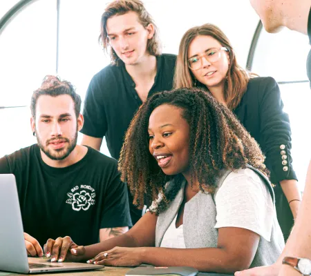 People looking at a computer