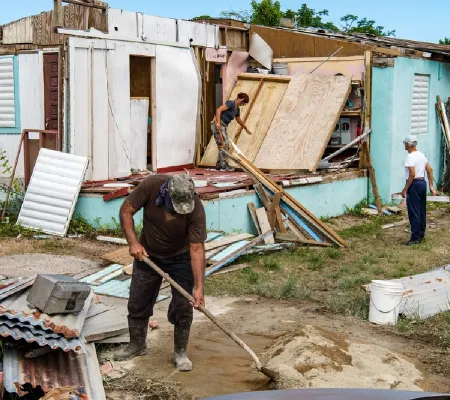 People clean up after a storm