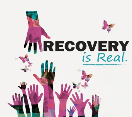 one hand reaching others hands with "Recovery is Real" phrase