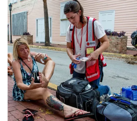 Red Cross Nurse Helping Woman