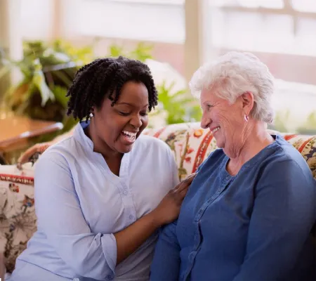 A woman and senior laughing