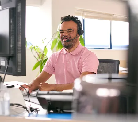 A man talking on the phone with headphone
