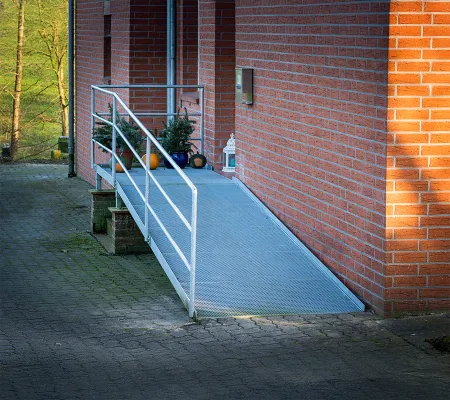 A brick building with a ramp on the entrance