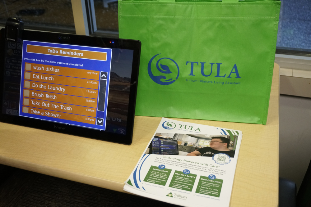 a woman infront of an audience presenting TULA