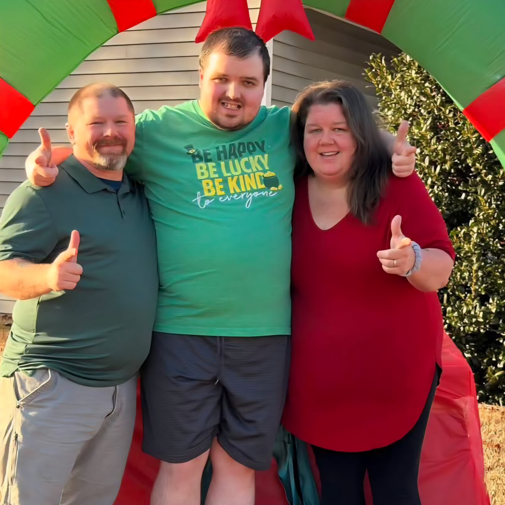 Picture of Cody father and mother smiling to the camera