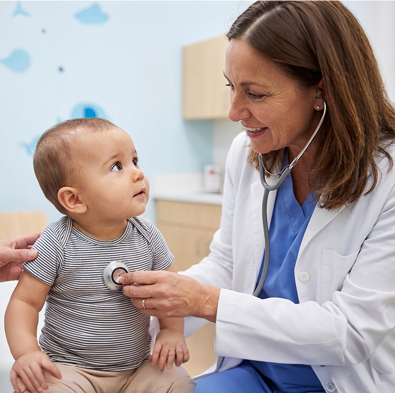 a doctor listen to a baby heart