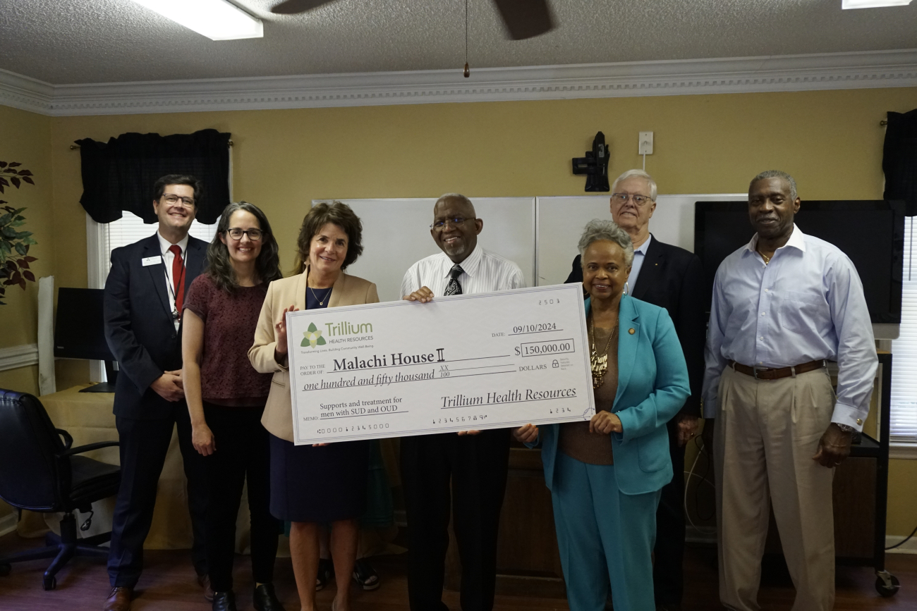 Group of people receiving a check