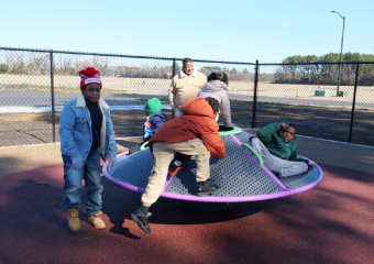 Kids playing on the Merry-go-around