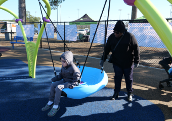 Kid playing in the swing