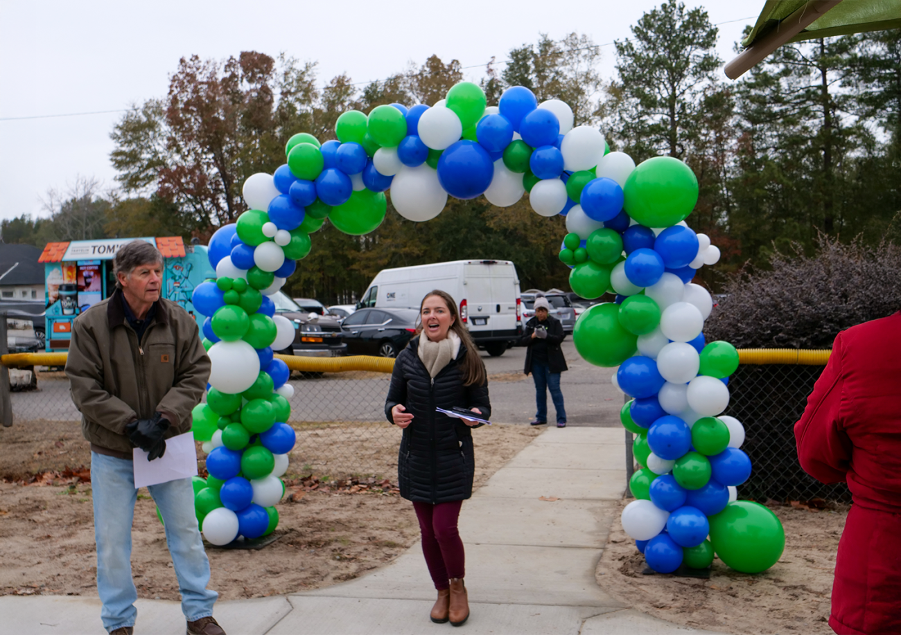 A woman making a speech in the opening of Raeford inclusive playground
