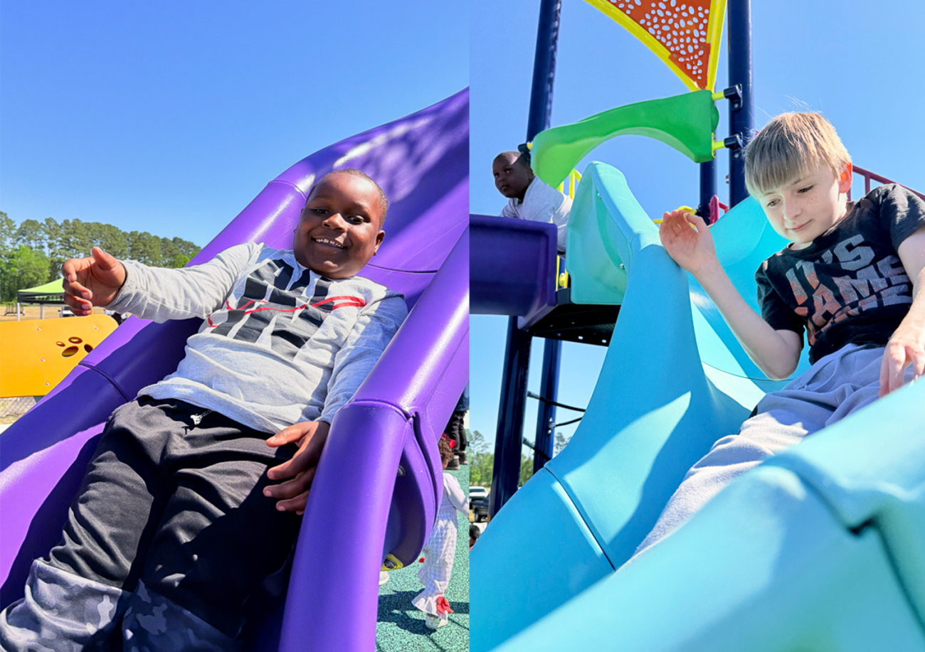 two kids playing on the slide