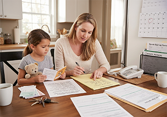 Mother a child preparing documents to go to the doctor