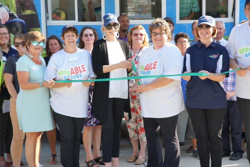 Group of people in the ceremony of Cutting ribbon for Food truck