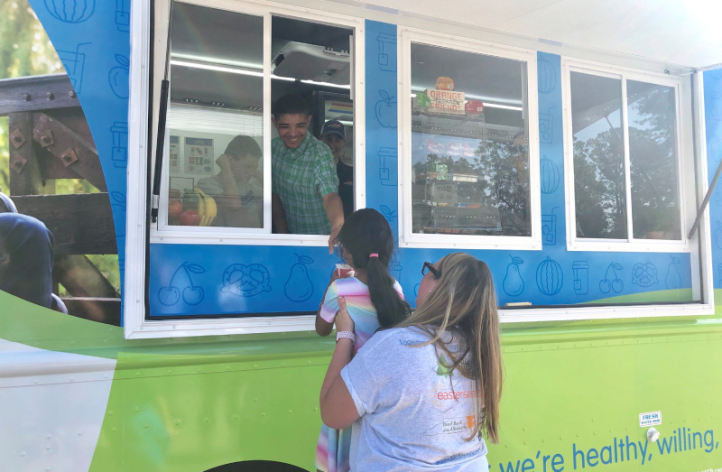 A woman and child were served on the food truck.